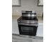 Modern Samsung stainless steel top range electric stove with black glass cooktop at 5411 Cliff Ridge Dr, Indianapolis, IN 46217