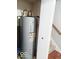 The hot water heater is conveniently located near the stairway at 5411 Cliff Ridge Dr, Indianapolis, IN 46217