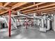 Open basement area with exposed ceiling, utility equipment, and washer/dryer at 5504 Indianola Ave, Indianapolis, IN 46220