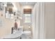 Well-lit bathroom featuring a modern sink, mirror, and stylish fixtures at 5504 Indianola Ave, Indianapolis, IN 46220