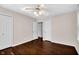 Spacious bedroom with hardwood floors, neutral walls, and a ceiling fan at 5504 Indianola Ave, Indianapolis, IN 46220
