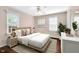 A cozy bedroom with a large bed, modern furnishings, and plenty of natural light at 5504 Indianola Ave, Indianapolis, IN 46220