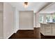 A dining area with hardwood floors, built-in storage, and a stylish light fixture at 5504 Indianola Ave, Indianapolis, IN 46220