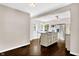 Open kitchen design with a granite island, stainless steel appliances, and a view of the dining area at 5504 Indianola Ave, Indianapolis, IN 46220