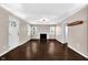Spacious living room with hardwood floors, a classic fireplace, and ample natural light at 5504 Indianola Ave, Indianapolis, IN 46220