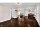 Open-concept living room with a view of the kitchen, hardwood floors, and neutral tones at 5504 Indianola Ave, Indianapolis, IN 46220