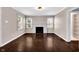 Inviting living room featuring a fireplace, neutral paint, and large windows with natural light at 5504 Indianola Ave, Indianapolis, IN 46220