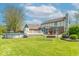 An exterior view of a home with an above ground pool, backyard, patio, and swing set at 562 Covered Bridge Rd, Greenwood, IN 46142