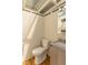 The functional bathroom with a classic toilet, wood-look cabinet, and utility sink provides all the basic necessities at 562 Covered Bridge Rd, Greenwood, IN 46142