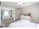 A bedroom with neutral walls, plush carpet and an en-suite closet with mirrored sliding doors at 562 Covered Bridge Rd, Greenwood, IN 46142