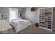 Comfortable bedroom with plush carpet, natural light, and wardrobe at 562 Covered Bridge Rd, Greenwood, IN 46142