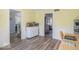 Bright dining area with table, wainscotting, and wood-look flooring at 562 Covered Bridge Rd, Greenwood, IN 46142