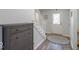 Welcoming entryway with wooden floors, white staircase, and front door with decorative stained glass window at 562 Covered Bridge Rd, Greenwood, IN 46142
