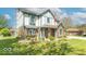 Charming two-story home with brick and siding exterior, manicured lawn, and inviting front entrance at 562 Covered Bridge Rd, Greenwood, IN 46142