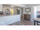 Modern kitchen with white cabinets, stainless steel appliances, and a laundry room to the right at 562 Covered Bridge Rd, Greenwood, IN 46142