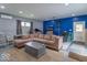 Relaxing living area with recessed lights, neutral paint, and a blue accent wall at 562 Covered Bridge Rd, Greenwood, IN 46142