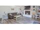 Cozy living room with a brick fireplace, built-in shelving, comfortable seating, and wood-look flooring at 562 Covered Bridge Rd, Greenwood, IN 46142