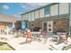 Inviting patio area with multiple seating arrangements perfect for outdoor dining and entertaining friends and Gathering at 562 Covered Bridge Rd, Greenwood, IN 46142