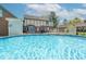Refreshing pool with ladder and patio seating area for relaxing and entertaining in this lovely backyard at 562 Covered Bridge Rd, Greenwood, IN 46142