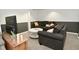Finished basement with neutral walls, plush seating and a round coffee table at 5938 Haverford Ave, Indianapolis, IN 46220