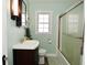 Bathroom featuring a vanity, toilet, tub and shower combination, and a window at 5938 Haverford Ave, Indianapolis, IN 46220