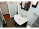 Bathroom vanity with a dark wood cabinet, mirror and gray accents at 5938 Haverford Ave, Indianapolis, IN 46220
