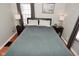 Cozy bedroom with a queen bed, two side tables, and plenty of natural light at 5938 Haverford Ave, Indianapolis, IN 46220