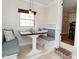 Cozy breakfast nook with built-in benches, a small table, and natural light at 5938 Haverford Ave, Indianapolis, IN 46220