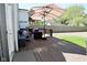 Outdoor wooden deck featuring comfortable blue patio furniture and shade umbrella at 5938 Haverford Ave, Indianapolis, IN 46220