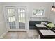 Cozy dining nook with a built-in bench, modern lighting, and access to outdoor patio at 5938 Haverford Ave, Indianapolis, IN 46220