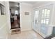Hallway with view of the kitchen and access to the backyard at 5938 Haverford Ave, Indianapolis, IN 46220