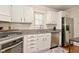 Bright kitchen with white cabinets, granite countertops, and stainless steel appliances at 5938 Haverford Ave, Indianapolis, IN 46220