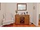A living room nook features a wooden bar cabinet with a mirror and wine storage at 5938 Haverford Ave, Indianapolis, IN 46220