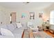 Comfortable living room with hardwood floors, a gray sofa, and bright natural light at 5938 Haverford Ave, Indianapolis, IN 46220