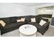 Spacious living room featuring plush seating, a marble coffee table, and ample room for entertaining at 5938 Haverford Ave, Indianapolis, IN 46220