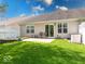 Spacious backyard with a patio, fenced yard, and well-manicured lawn at 6146 Franklin Villas Way, Indianapolis, IN 46237