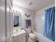 Bright bathroom with modern fixtures, a shower-tub combination, and ample counter space at 6146 Franklin Villas Way, Indianapolis, IN 46237
