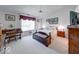 Comfortable bedroom with a vaulted ceiling, a window, carpet and dark wood furniture at 6146 Franklin Villas Way, Indianapolis, IN 46237
