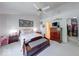 Bright bedroom featuring vaulted ceiling and carpet, with direct access to a closet and a bathroom at 6146 Franklin Villas Way, Indianapolis, IN 46237