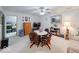 Bonus room with round table and 4 chairs, carpet and TV on a dresser at 6146 Franklin Villas Way, Indianapolis, IN 46237
