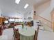 Open concept dining room flows into a living room with lots of natural light and staircase to the second floor at 6146 Franklin Villas Way, Indianapolis, IN 46237