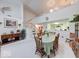Spacious dining room with vaulted ceilings, hardwood furniture and an adjacent kitchen area at 6146 Franklin Villas Way, Indianapolis, IN 46237