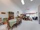 Open floor plan featuring a dining area with vaulted ceilings and seamless access to the living room at 6146 Franklin Villas Way, Indianapolis, IN 46237