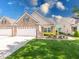 Charming townhome with attached garage, brick accents, and well-maintained lawn at 6146 Franklin Villas Way, Indianapolis, IN 46237