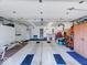 Spacious garage featuring ample storage cabinets, work area, and a well-lit interior at 6146 Franklin Villas Way, Indianapolis, IN 46237