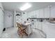 Functional kitchen with white cabinetry, breakfast bar, and efficient layout at 6146 Franklin Villas Way, Indianapolis, IN 46237