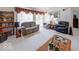 Cozy living area with a sliding glass door, plush seating, and a view of the backyard at 6146 Franklin Villas Way, Indianapolis, IN 46237