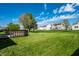 A spacious backyard includes a wood deck that is perfect for outdoor enjoyment at 6472 Creekshore Ln, Indianapolis, IN 46268