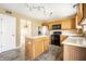 Functional kitchen featuring a center island, stainless steel appliances, and plenty of counter space at 6472 Creekshore Ln, Indianapolis, IN 46268