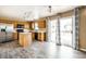 Updated kitchen features stainless steel appliances, light wood cabinets, and access to the backyard at 6472 Creekshore Ln, Indianapolis, IN 46268